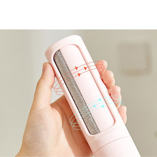 Hand holding a reusable pet hair remover roller